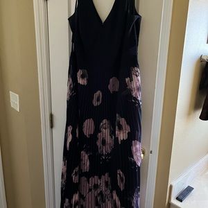 Floor length pleated xscape dress.